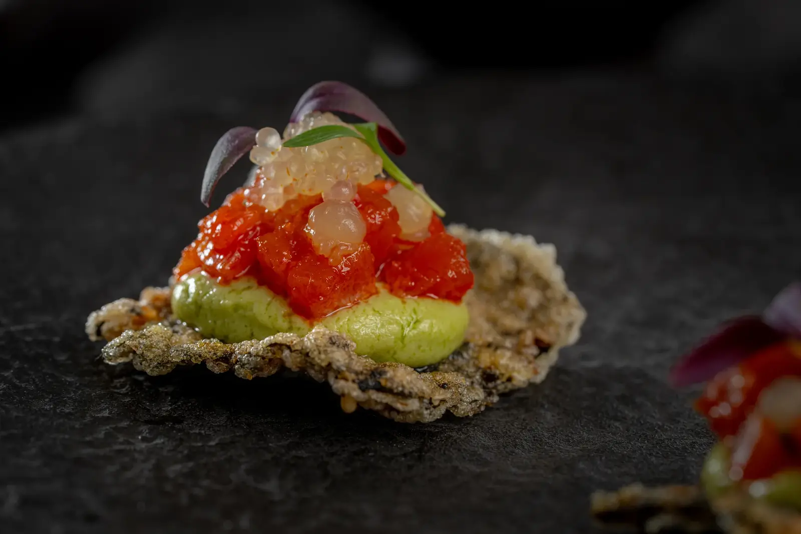 Tomato tartare canapé with clear pearls and a green purée on a crisp wafer, canapé catering in Cape Town by myCHEF Cape Town