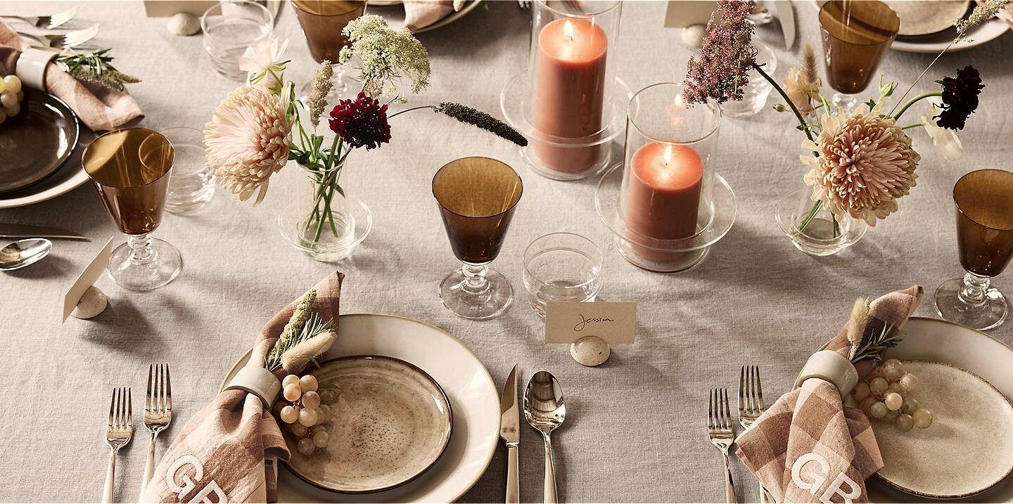 Styled celebration table with glassware and flowers ready for an engagement party
